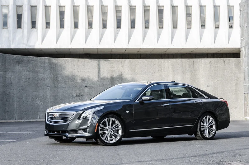 Black Cadillac CT6 in front of a wall