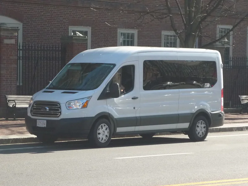 White Ford Transit Passenger Wagon