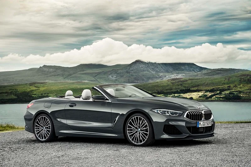 BMW 8-Series parked next to a lake