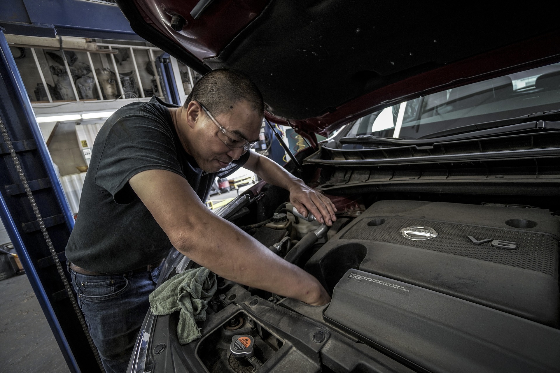 man performing oil change