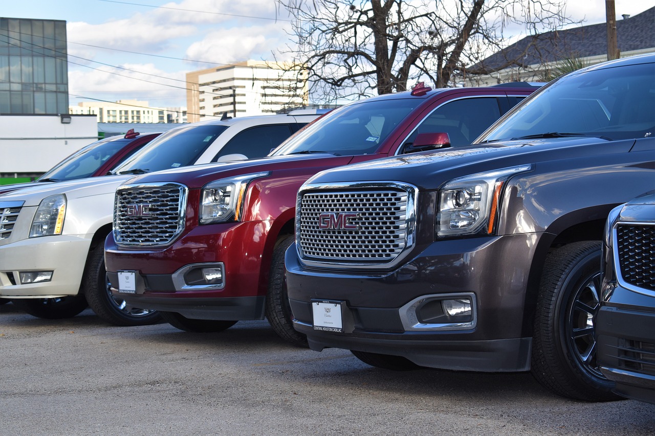 cars in a row on a dealer lot